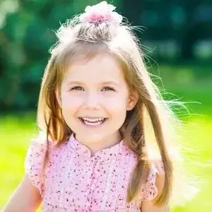 A little girl in a pink dress