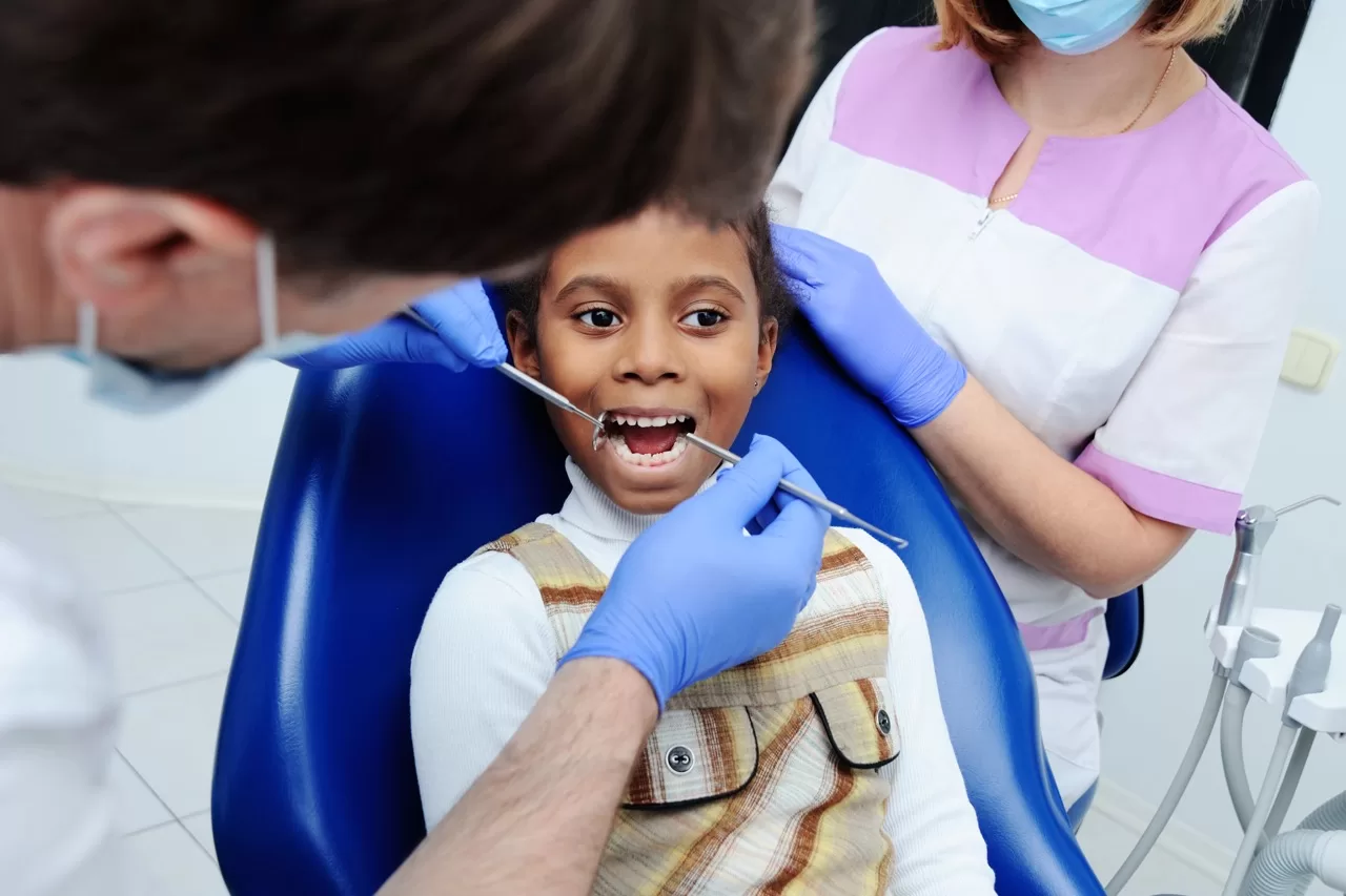 Child getting a pediatric dental exam