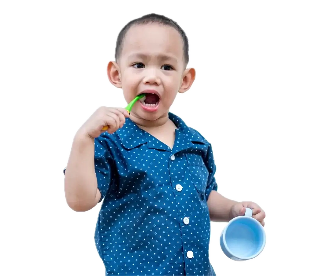 Toddler brushing teeth while holding a rinse cup