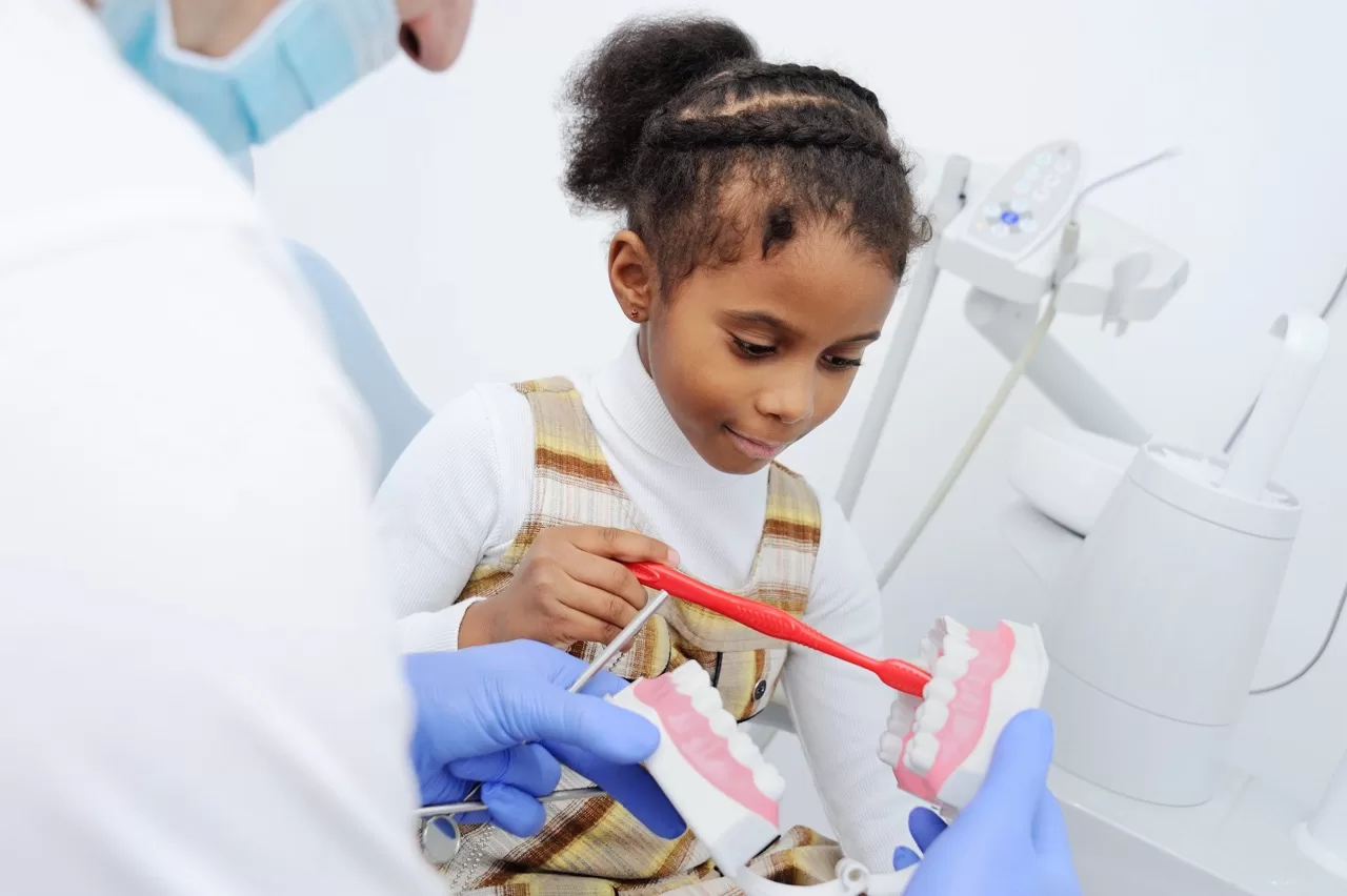 Child learning proper brushing