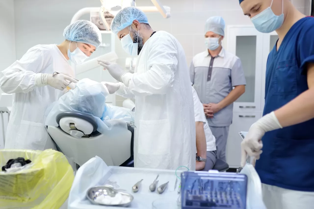 Dental care team working together during a treatment procedure