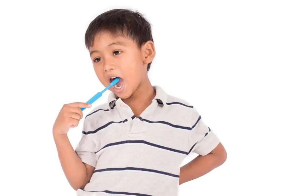 Child brushing his teeth